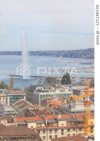 Panoramic view of city of Geneva, Lake Geneva and Jet d'Eau fountain in Switzerland. View from the bell tower of Saint Pierre Cathedral 125146530