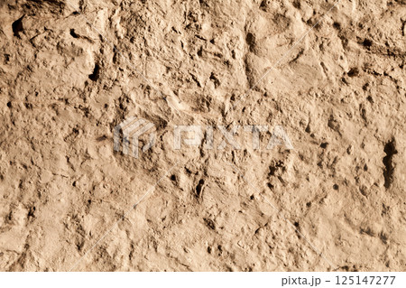 Rough yellow sandstone wall background Rough yellow sandstone wall background 125147277