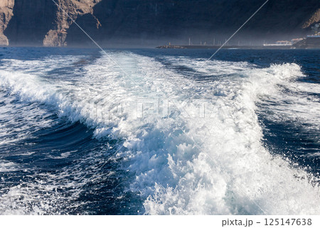 Wake trace behind speed boat Wake trace behind speed boat 125147638