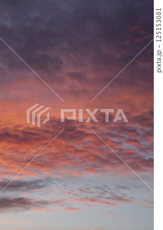 Various colors of the sunset. Fluffy clouds. Romantic sky. Universal vertical photo. The background picture. Various colors of the sunset. Fluffy clouds. Romantic sky. Universal vertical photo. The background picture. 125153081