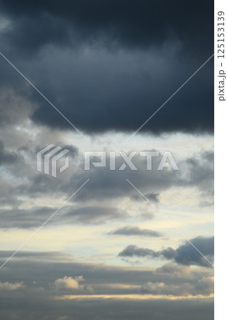 Vertical photo of blue clouds in cloudy weather. Aesthetic neutral photo. Vertical photo of blue clouds in cloudy weather. Aesthetic neutral photo. 125153139