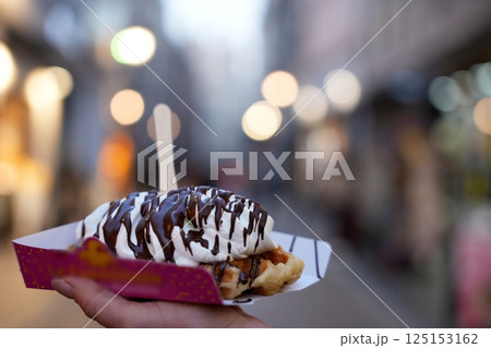 Belgian Waffle with Whipped Cream and Chocolate Drizzle 125153162