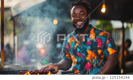 Portrait of a Caribbean street chef smiling while cooking jerk meat over an open flame grill, colorful shirt, smoky background, tropical vibe, urban island market scene 125154144