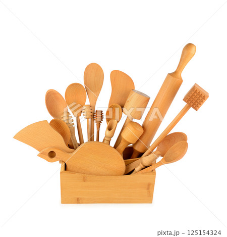 Set of wooden kitchen utensils isolated on white. Set of wooden kitchen utensils isolated on white. 125154324