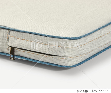 Close-up of removable cushion cover with zipper showing high-quality fabric and stitching 125154627