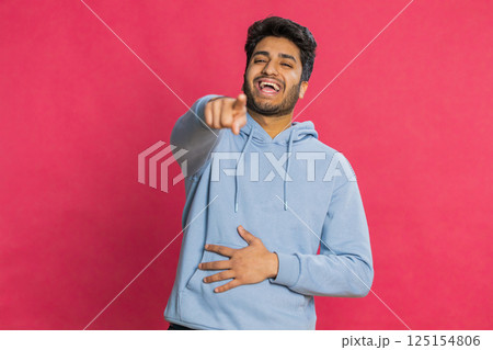 Happy excited Indian man laughing out loud after hearing ridiculous anecdote, reaction on funny joke Happy excited Indian man laughing out loud after hearing ridiculous anecdote, reaction on funny joke 125154806