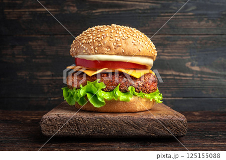 Chicken burger, cheeseburger on dark wooden background 125155088