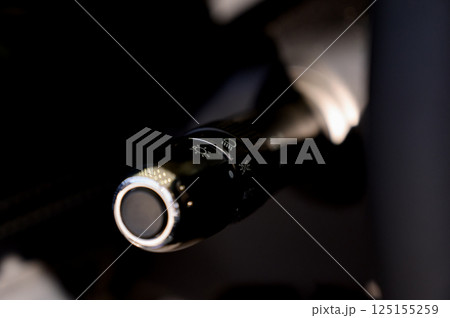 Close up view of car light switch control. Headlight switch, turn signal lever Close up view of car light switch control. Headlight switch, turn signal lever 125155259
