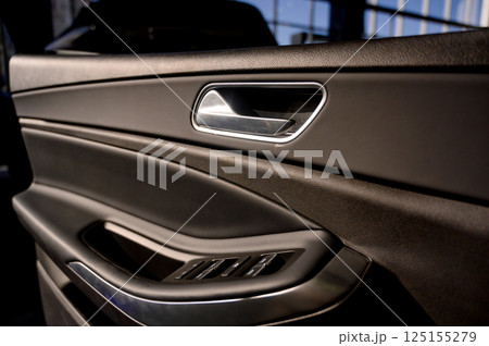 Car door with door handle and window control and adjustment button 125155279