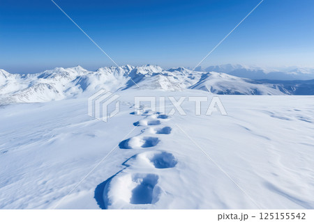 Footprints in the snow on the top of the mountain. Winter landscape. 125155542