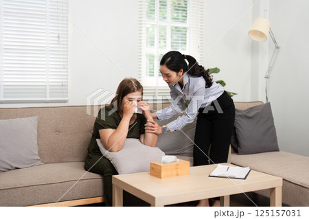 Psychotherapy and Emotional Support. A psychiatrist comforting a patient in distress, offering compassionate care during a critical moment. 125157031