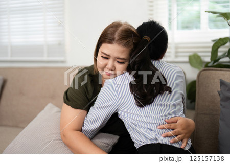 Therapeutic Embrace and Trust. A psychiatrist comforting a client with a warm hug during an emotional moment. Therapeutic Embrace and Trust. A psychiatrist comforting a client with a warm hug during an emotional moment. 125157138
