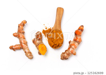Dry Turmeric powder and turmeric root isolated on white background ,Top view Dry Turmeric powder and turmeric root isolated on white background ,Top view 125162699