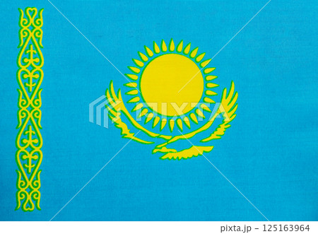 Kazakhstan flag with sun and eagle design displayed 125163964