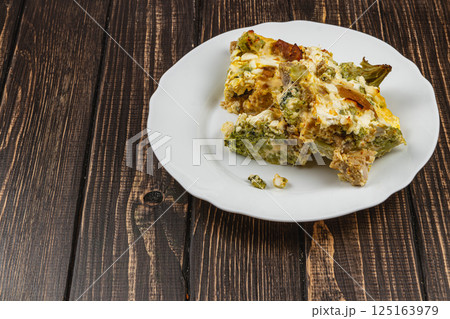 Savory casserole with chicken, broccoli, and sour cream for a hearty meal Savory casserole with chicken, broccoli, and sour cream for a hearty meal 125163979