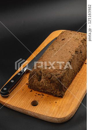 Homemade chicken liver pate served on a wooden cutting board Homemade chicken liver pate served on a wooden cutting board 125163982