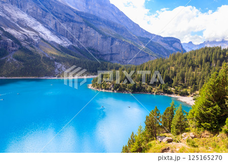 View of Oeschinen lake (Oeschinensee) and Swiss Alps near Kandersteg in Bernese Oberland, Switzerland 125165270