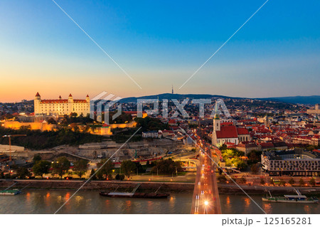 View of Bratislava castle, old town and the Danube river from observation deck the bridge in Bratislava, Slovakia at night 125165281