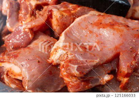 Pieces of fresh pork in marinade Pieces of fresh pork in marinade 125166033