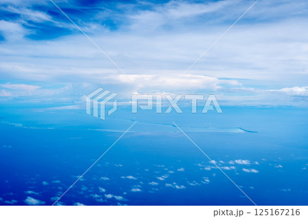 Aerial view of the Tuamotus atoll in French Polynesia with clouds Aerial view of the Tuamotus atoll in French Polynesia with clouds 125167216