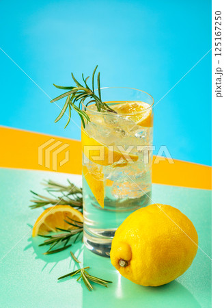 Refreshing cocktail with gin, tonic, lemon, and rosemary. Refreshing cocktail with gin, tonic, lemon, and rosemary. 125167250