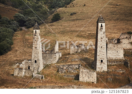 High stone towers in the Caucasus, medieval castle and town in the mountains, close-up High stone towers in the Caucasus, medieval castle and town in the mountains, close-up 125167823