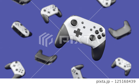 Realistic video game joysticks or gamepads rotating and falling on violet 125168439