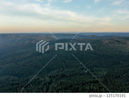 Drone aerial view in the evening with horizon over Black Forest mountains Drone aerial view in the evening with horizon over Black Forest mountains 125170191
