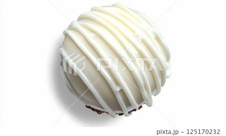Delicious coconut praline with white chocolate drizzle on white background. 125170232