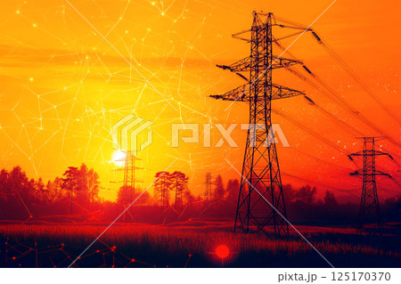A UK power substation with towering power lines and transformers, set against an orange sky, possibly during sunset or sunrise. The scene highlights electricity distribution, energy infrastructure 125170370