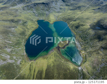Aerial view of beautiful high altitude mountains and lake landscape Aerial view of beautiful high altitude mountains and lake landscape 125171195