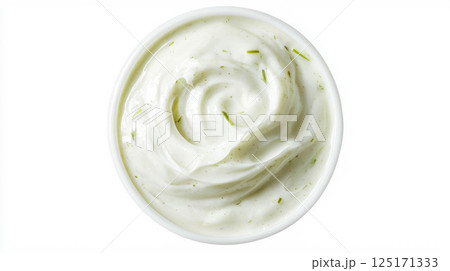 Creamy corn and leek soup garnished with fresh herbs. 125171333