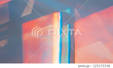 Vibrant prismatic texture of blue and red wall with rainbow light effects. 125171536