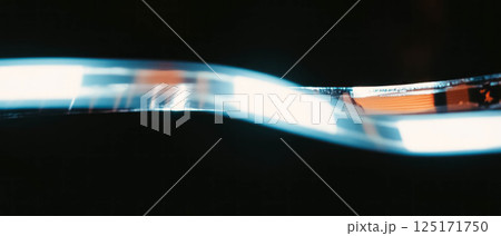 Overlay texture featuring smooth film with an empty center and clean surface on a dark background. 125171750