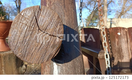 Wooden Swing Set Support with Chain against a Beautiful Natural Background Setting 125172173