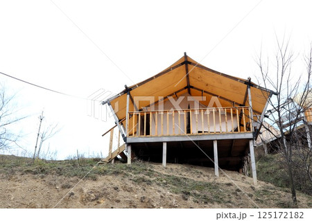 Charming Elevated Glamping Tent Cabin Nestled on a Beautiful Hill Surrounded by Nature Charming Elevated Glamping Tent Cabin Nestled on a Beautiful Hill Surrounded by Nature 125172182