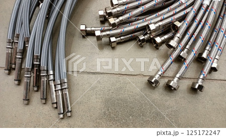A versatile collection of flexible plumbing hoses with durable metal connectors for many uses 125172247