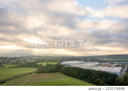 Factory and warehouse at sunrise in a village in Baden Wurttemberg region, Germany Factory and warehouse at sunrise in a village in Baden Wurttemberg region, Germany 125174896