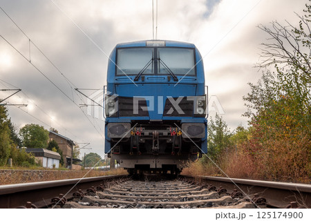Front view of electric locomotive transporting fuel storage tanks 125174900