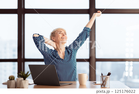 Work Is Done. Happy Mature Businesswoman At Laptop Stretching Having Break Sitting In Modern Office. Selective Focus 125176022