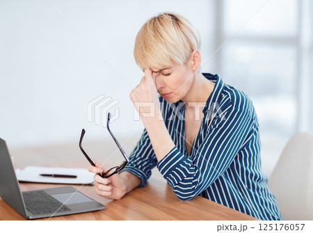Eyes Fatigue. Overworked Business Lady Having Eyestrain Massaging Nosebridge Sitting In Modern Office. Selective Focus 125176057