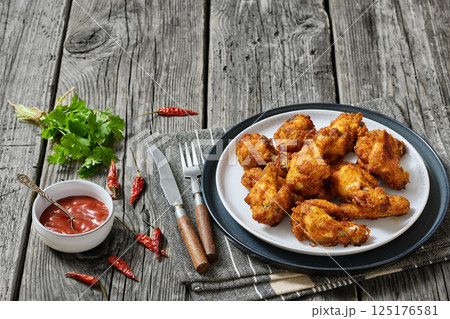 crispy fried chicken wings on a plate crispy fried chicken wings on a plate 125176581