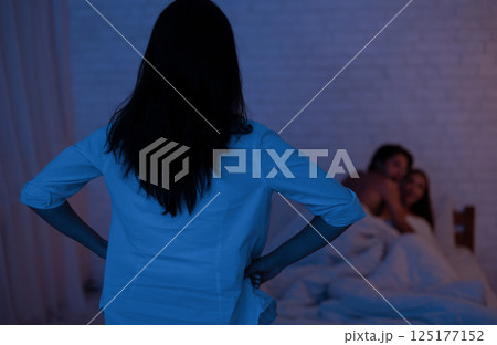 Cheating. Girl Catching Unfaithful Boyfriend With Another Woman In Bed Making Love In Bedroom. Low Light, Selective Focus Cheating. Girl Catching Unfaithful Boyfriend With Another Woman In Bed Making Love In Bedroom. Low Light, Selective Focus 125177152