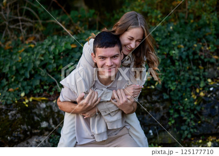 Young Cute Female Hugs Boyfriend. In Autumn Outdoor. Lovers Walking in Park. Attractive Funny Couple. Lovestory in Forest. Man and Woman. Cute Lovers in the Park. Family Concept. Happy Couple. Young Cute Female Hugs Boyfriend. In Autumn Outdoor. Lovers Walking in Park. Attractive Funny Couple. Lovestory in Forest. Man and Woman. Cute Lovers in the Park. Family Concept. Happy Couple. 125177710