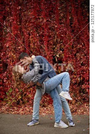 Young Cute Female Hugs Boyfriend. In Autumn Outdoor. Lovers Walking in Park. Attractive Funny Couple. Lovestory in Forest. Man and Woman. Cute Lovers in the Park. Family Concept. Happy Couple. Young Cute Female Hugs Boyfriend. In Autumn Outdoor. Lovers Walking in Park. Attractive Funny Couple. Lovestory in Forest. Man and Woman. Cute Lovers in the Park. Family Concept. Happy Couple. 125177872