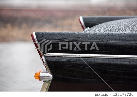 Vintage Car Fins and Tail Lights in Rainy Weather 125178726