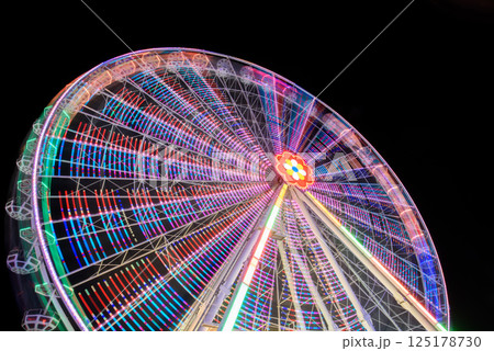 Colorful Ferris Wheel Illuminated at Night 125178730