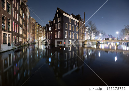 Canal Houses Reflected at Night in Amsterdam Canal Houses Reflected at Night in Amsterdam 125178731