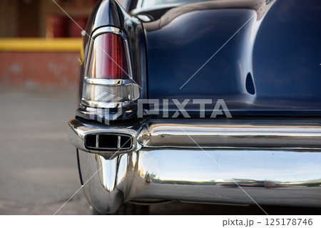 Rear Detail of a Dark Blue Vintage Car with Chrome Bumper Rear Detail of a Dark Blue Vintage Car with Chrome Bumper 125178746