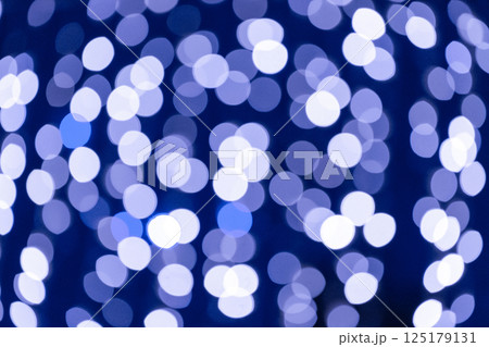 Abstract blue bokeh lights creating warm and festive atmosphere 125179131